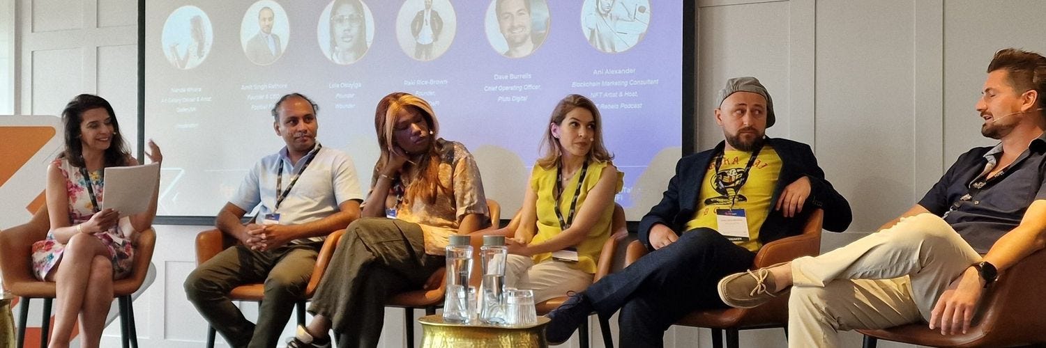 David Burrells on a conference panel with five other speakers